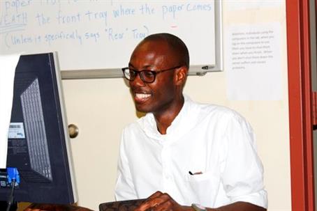 Calvin Gerald looking at a computer.